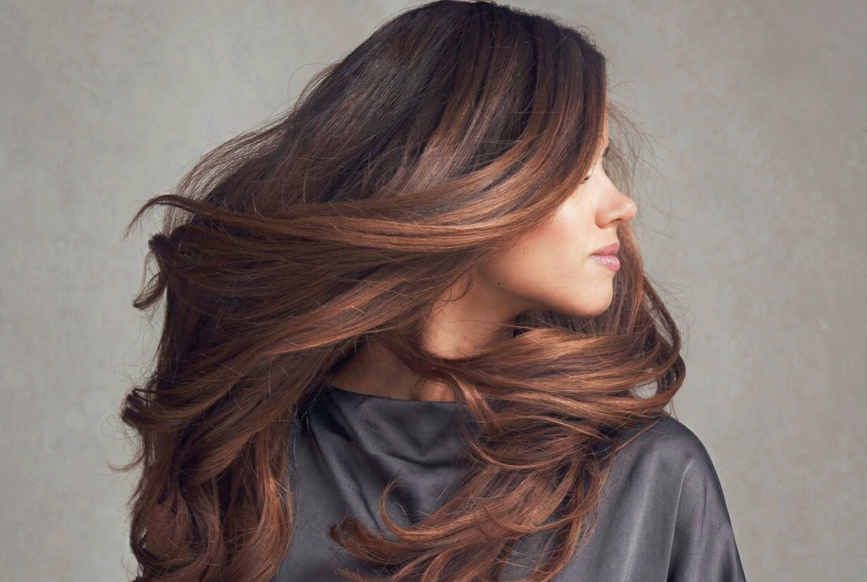 Woman with shiny brown hair in motion
