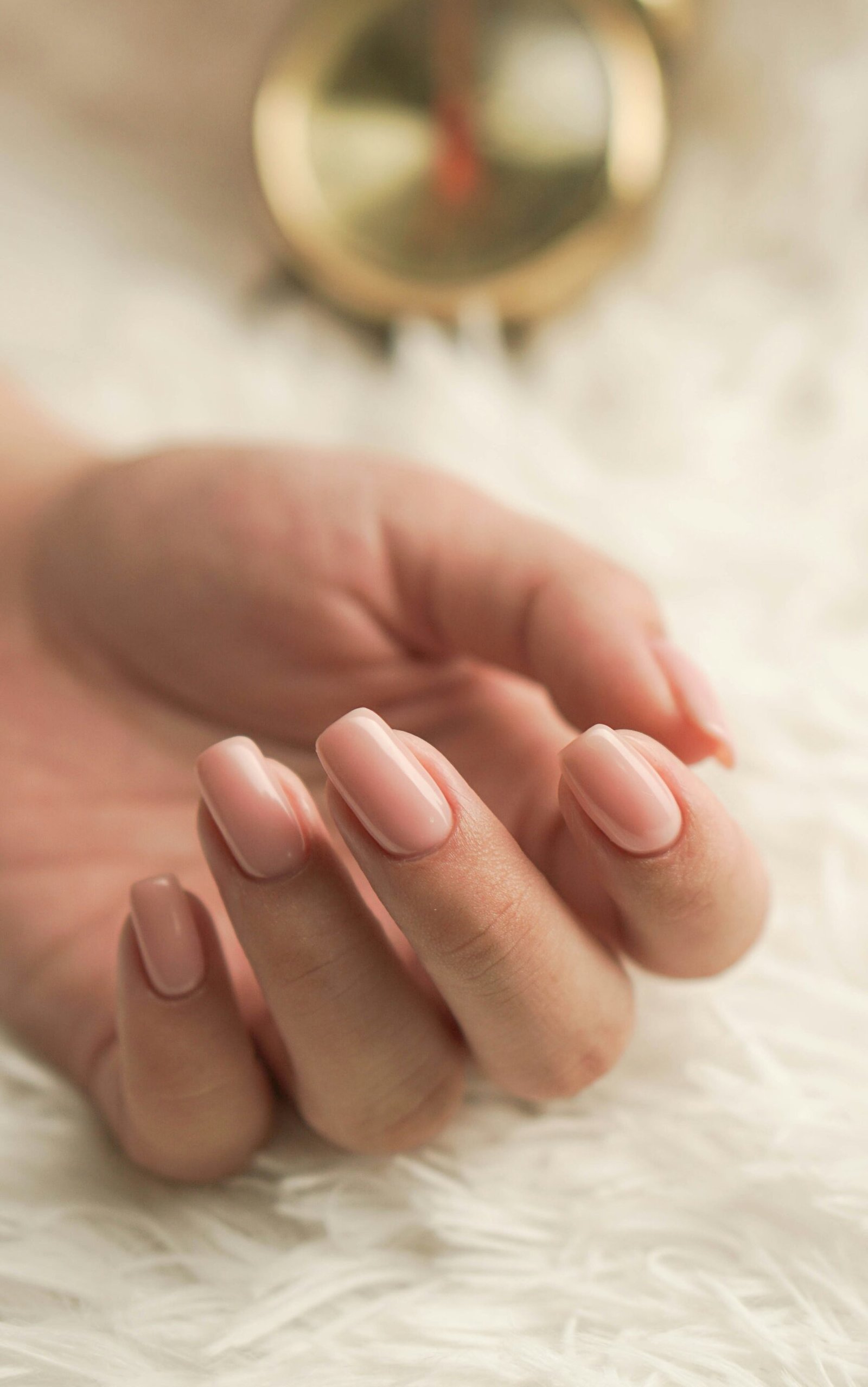 Well-manicured hand with glossy nail polish